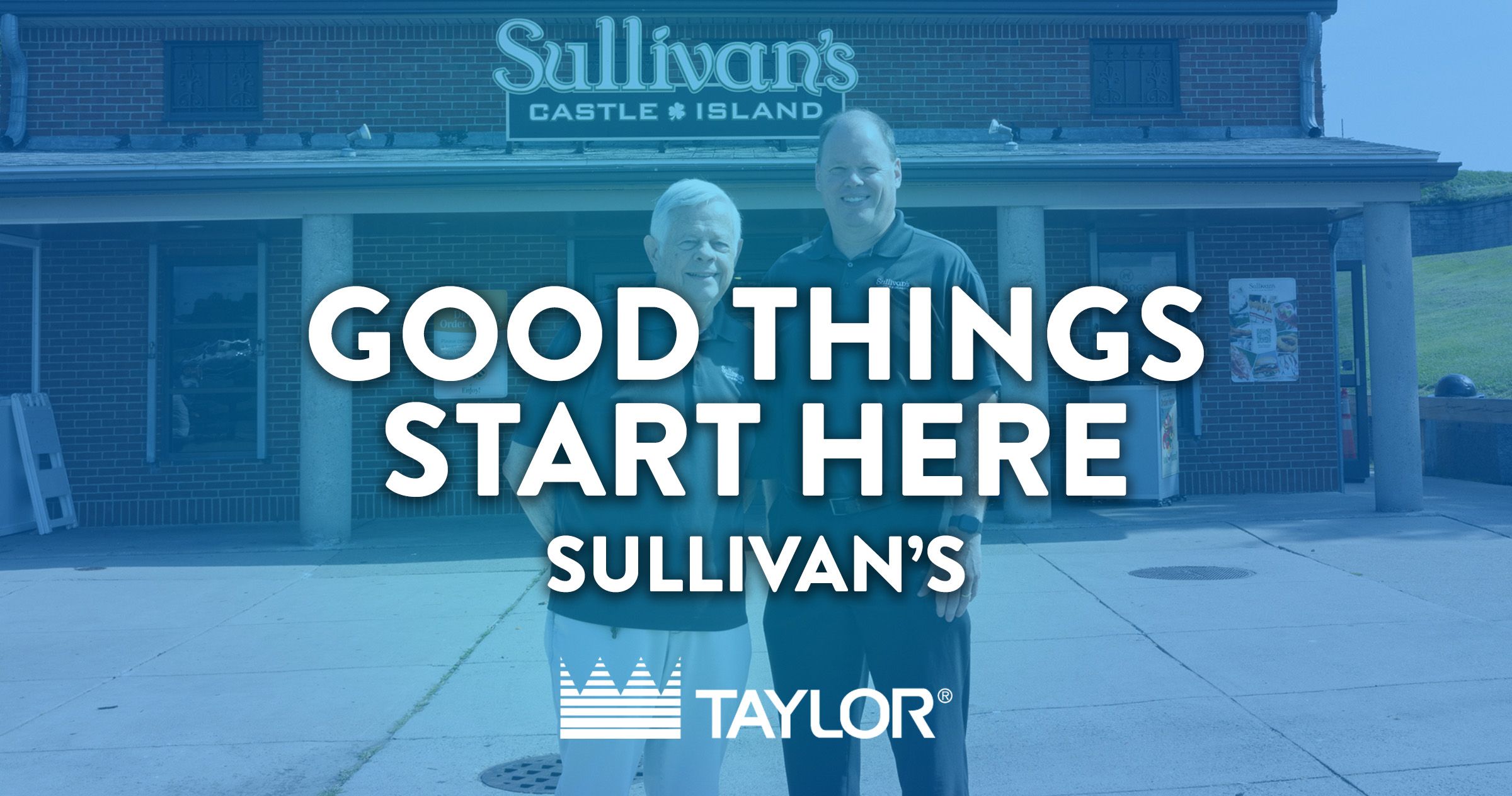 Two men standing in front of a brick building with a sign "Sullivan's Castle Island". Overlaid text reads "Good things start here. Sullivan's".