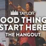The background is a smiling woman in a red flower dress with both hands pointing upwards. Text in the foreground reads "Taylor. Good things start here. The hangout."